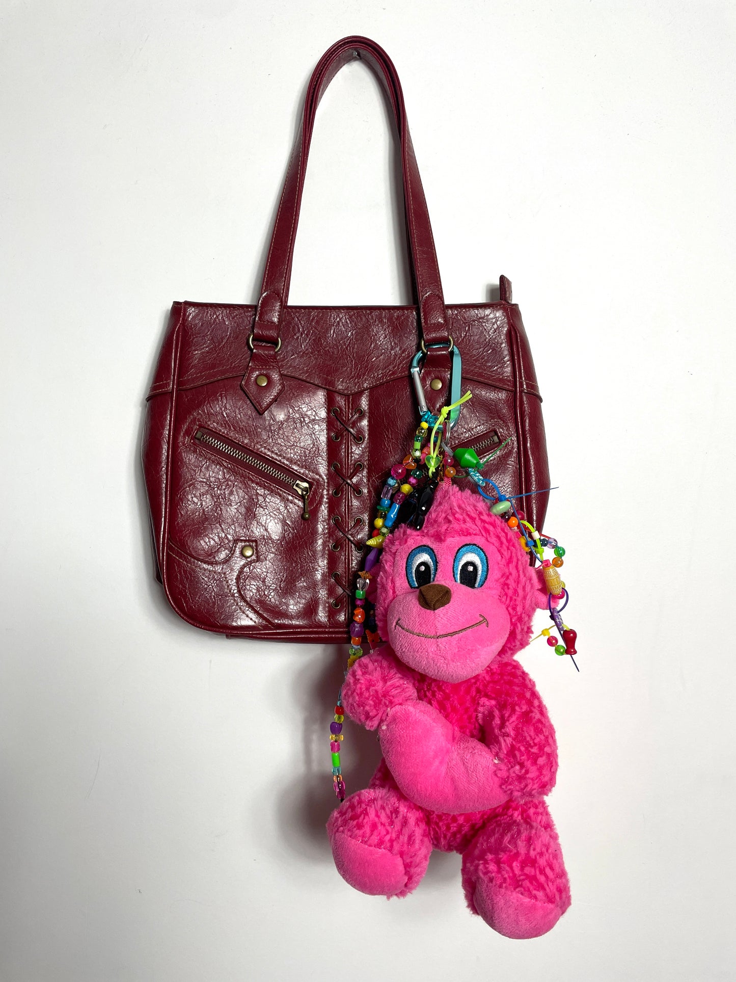 Bijou de sac singe rose
