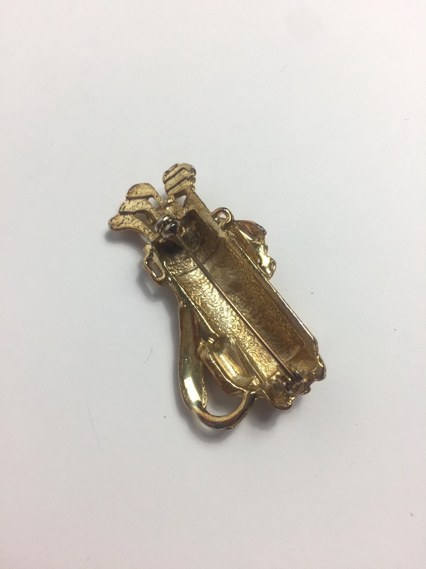 Broche dorée golf