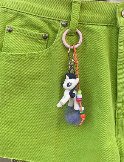 Bijou de sac poney blanc